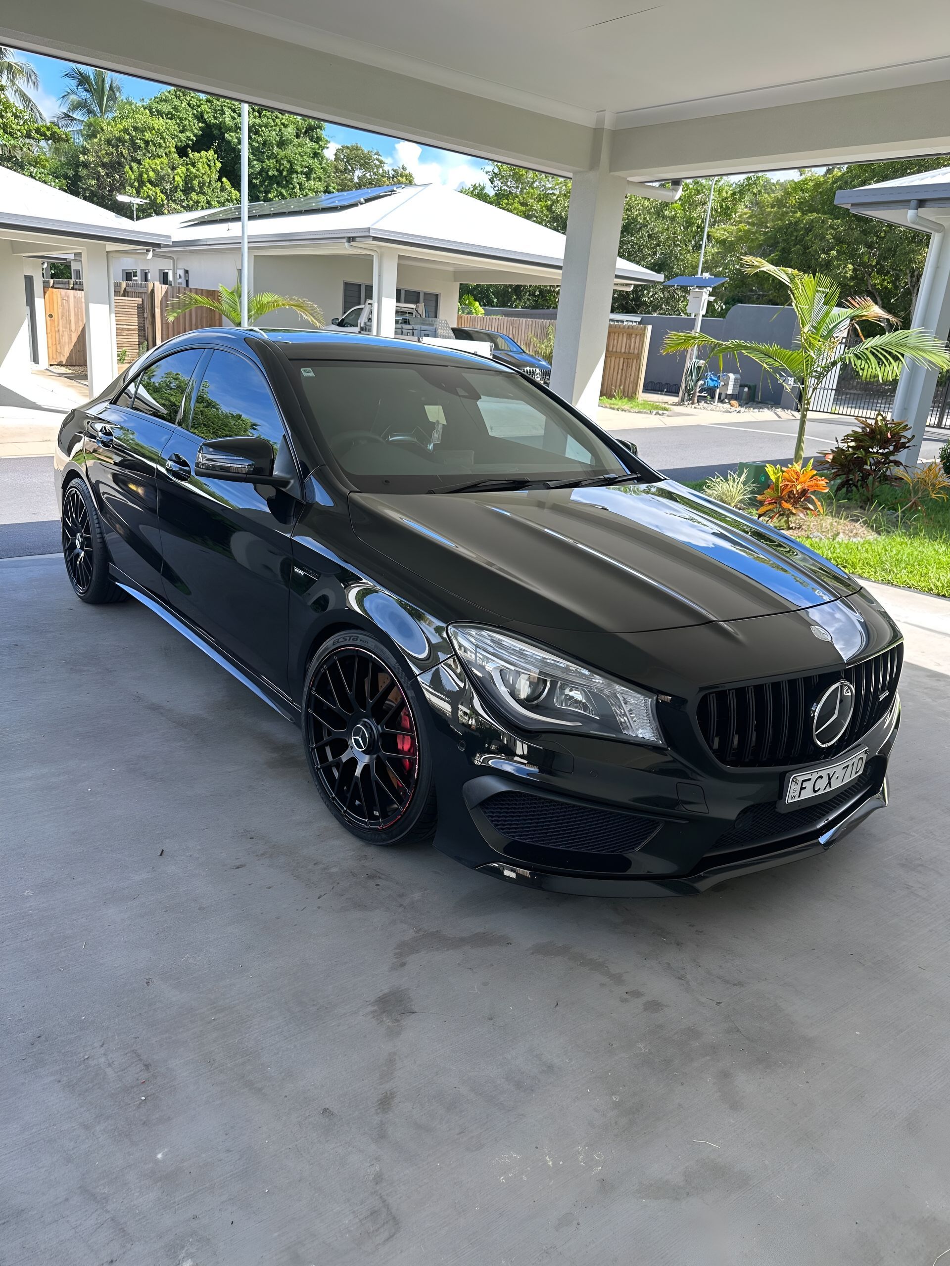 Black Mercedes Cla Coupe Parked Under a Carport — Mobile Club Car Cleaning in Earlville, QLD