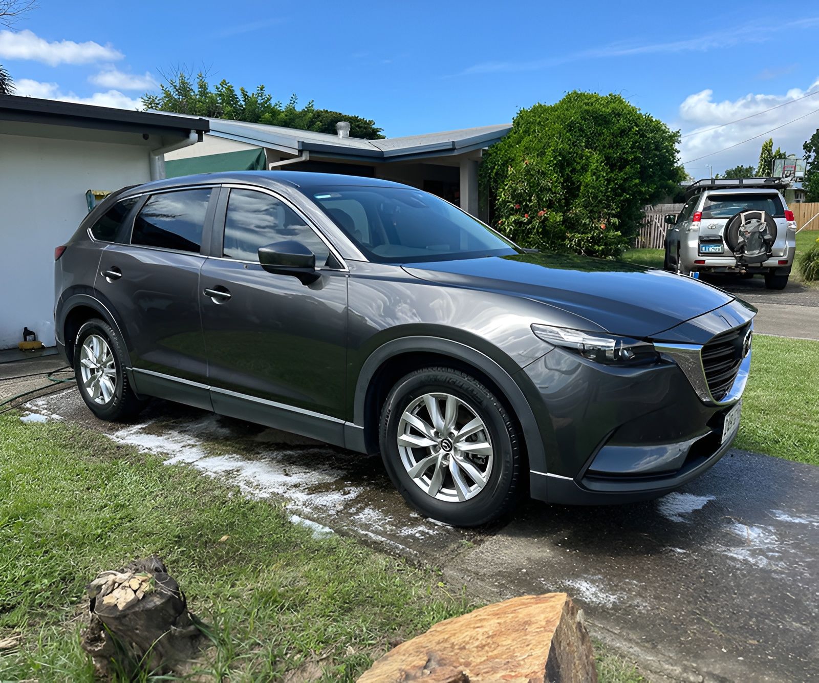 Gray Mazda parked on a driveway after being washed— Mobile Club Car Cleaning in Earlville, QLD