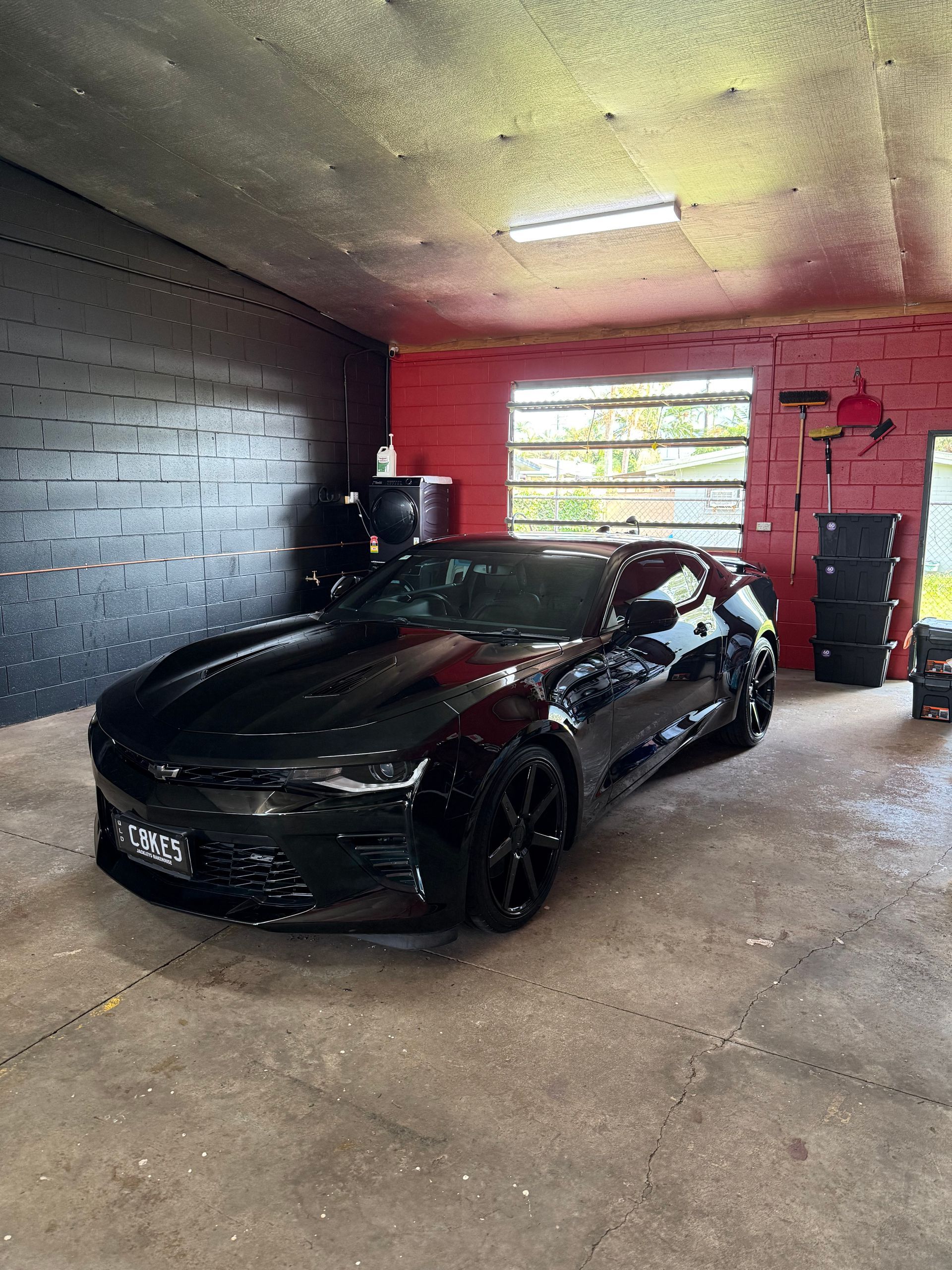 Black Chevrolet Camaro in a Garage, Black Wheels — Mobile Club Car Cleaning in Earlville, QLD