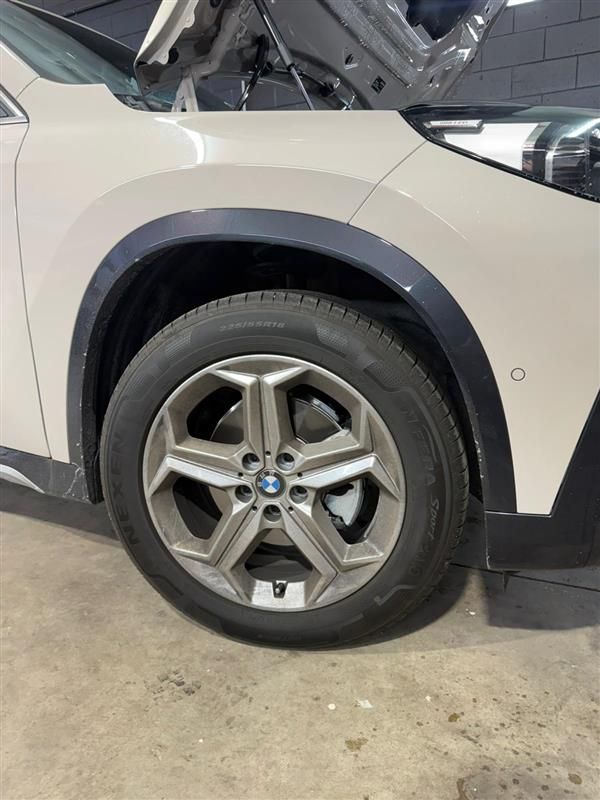 White BMW car wheel with dark gray trim, open hood — Mobile Club Cars Cairns in Earlville, QLD