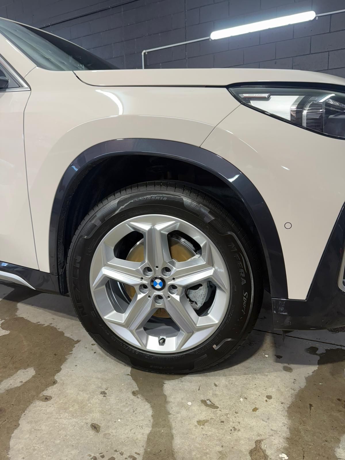 Beige BMW car wheel, black trim, silver rim — Mobile Club Cars Cairns in Earlville, QLD