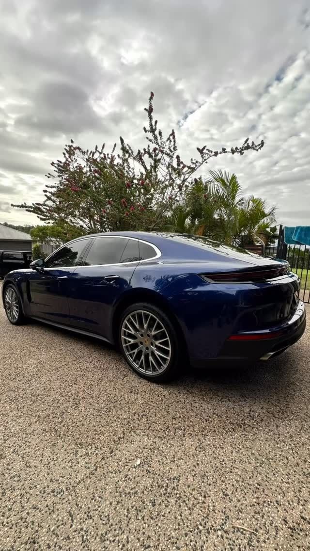 Blue Porsche parked on gravel; overcast sky in background – Mobile Club Car Cleaning in Earlville, QLD