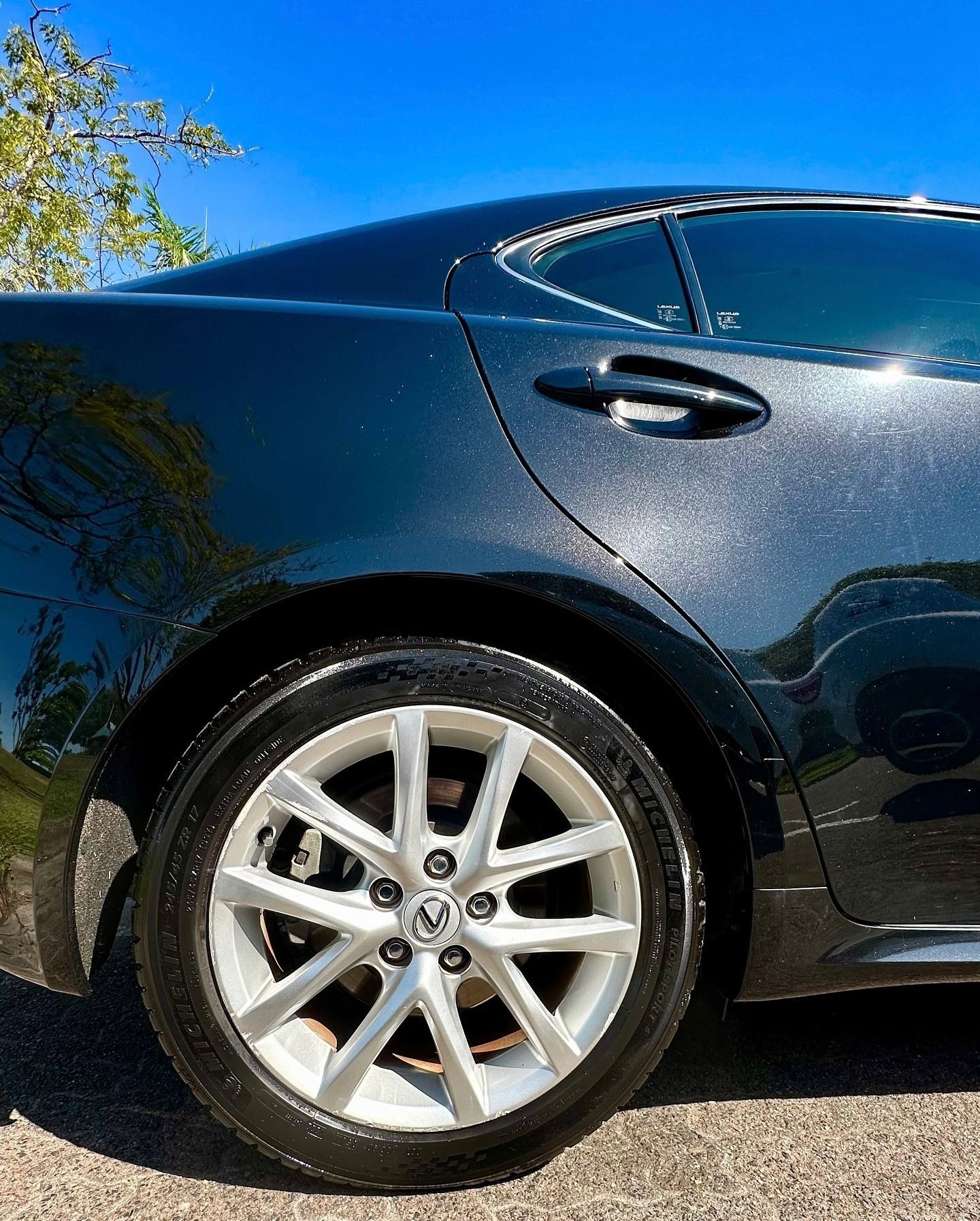 Black Sedan's Rear Quarter Panel and Wheel — Mobile Club Car Cleaning in Earlville, QLD