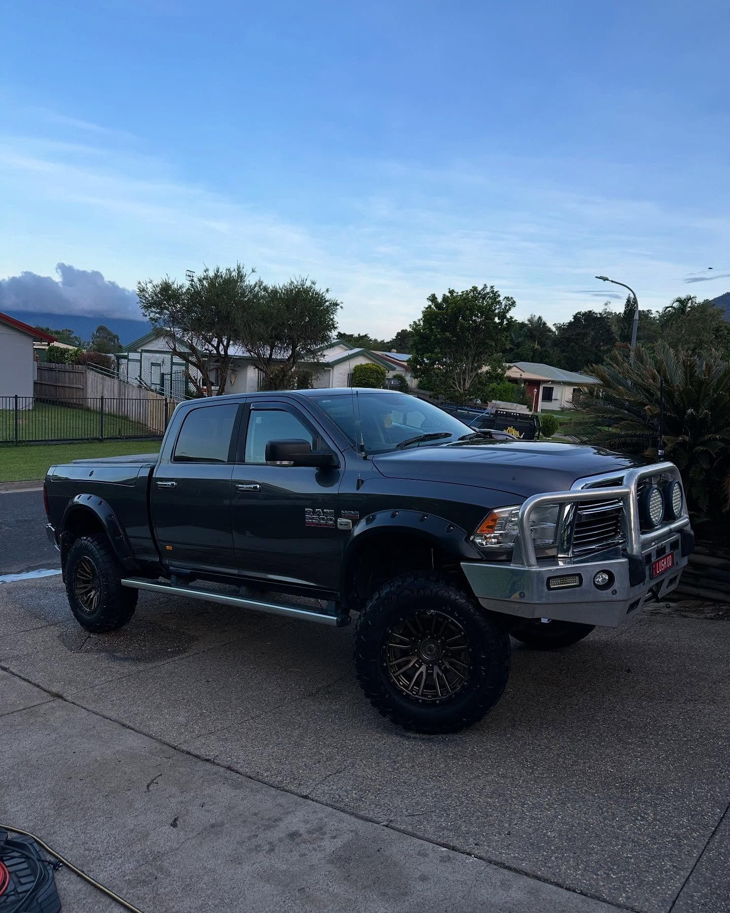 Dark Gray Dodge Ram Pickup Truck Parked on a Driveway — Mobile Club Car Cleaning in Earlville, QLD