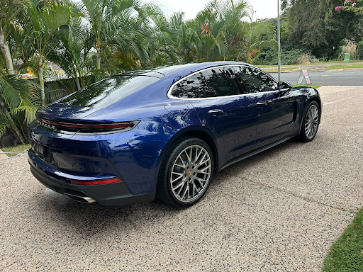 Blue Porsche Car Parked on a Paved Driveway — Mobile Club Car Cleaning in Earlville, QLD