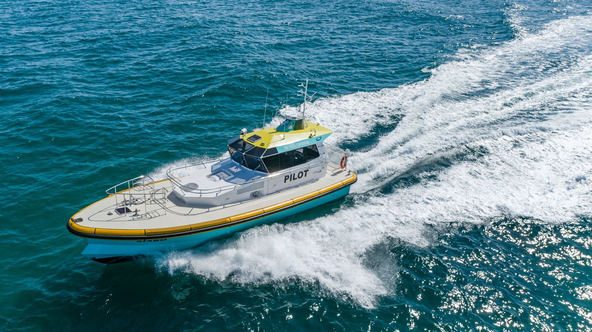 Fishing boat on calm water at dusk with birds overhead.