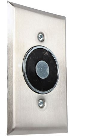A person is holding a stainless steel door handle.