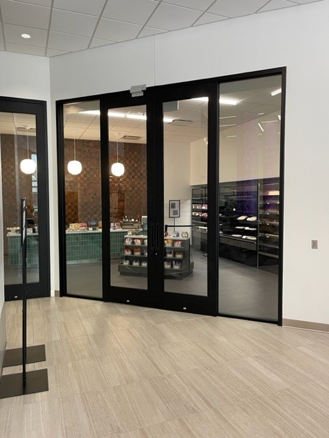 A warehouse filled with lots of glass and boxes.
