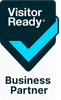 A visitor ready business partner logo with a blue check mark.