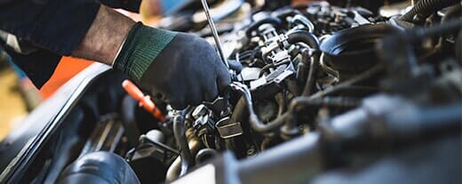 Person working with car — Automotive Repair in Kinston, NC