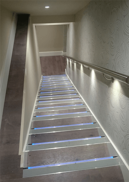 staircase with modern lighting