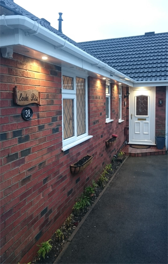 outdoor lighting on brick property