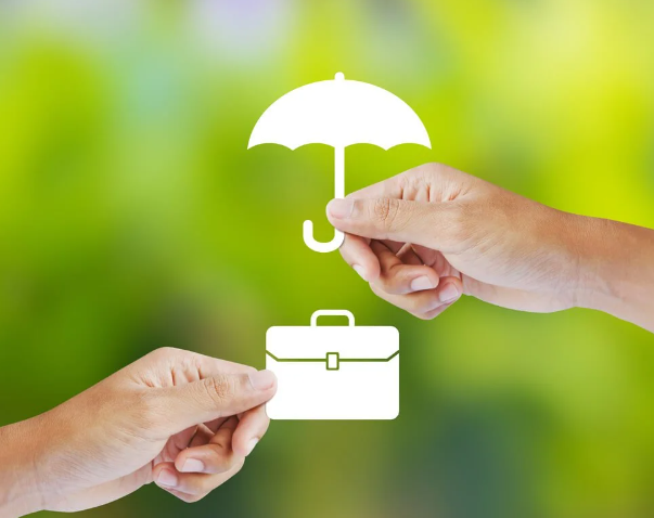 close up of umbrella cutout over business briefcase