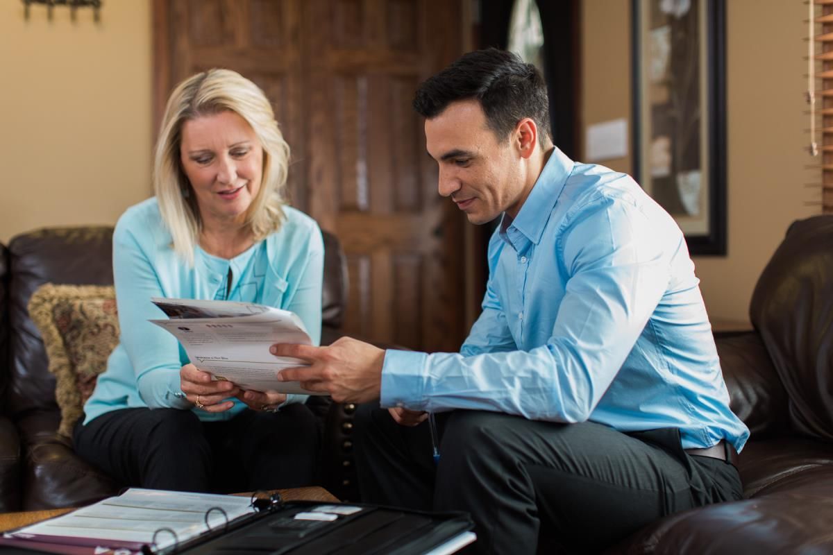 two individuals discuss commercial umbrella insurance