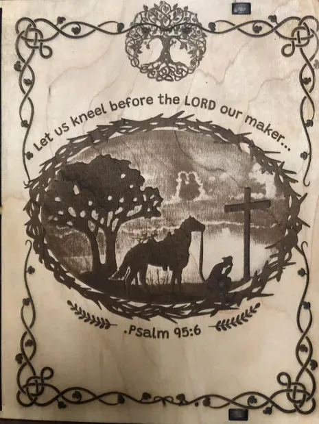 A sign that says let us kneel before the lord our maker