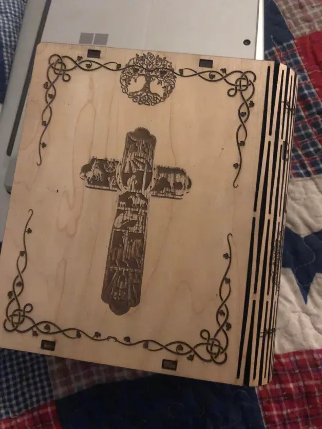 A wooden box with a cross on it
