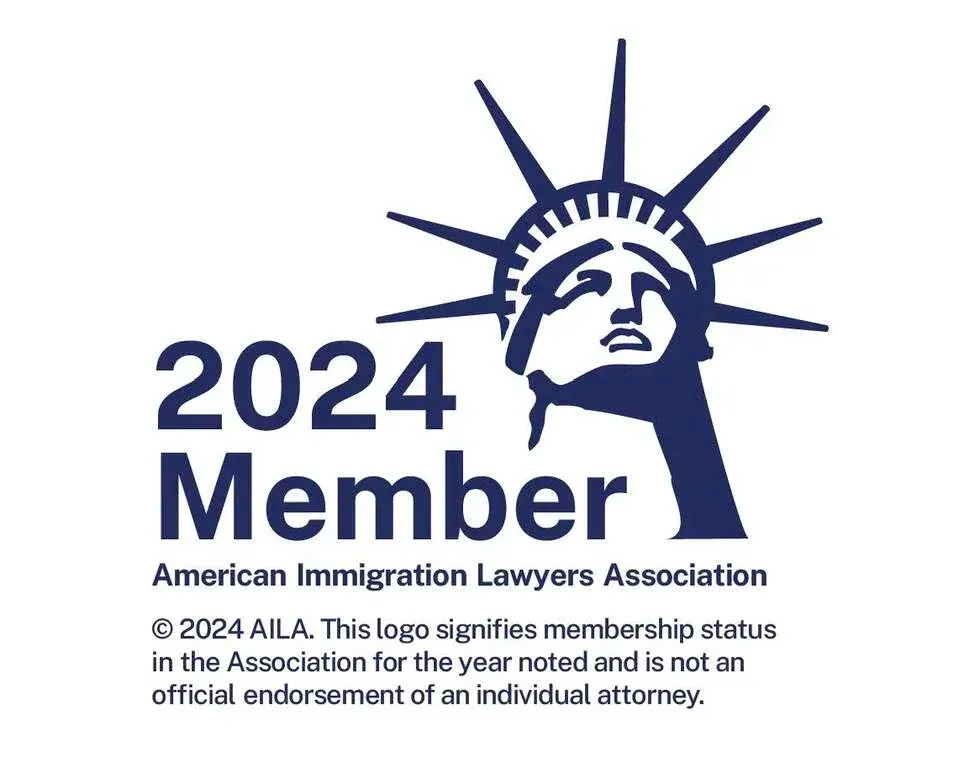 The logo for the american immigration lawyers association shows the statue of liberty.