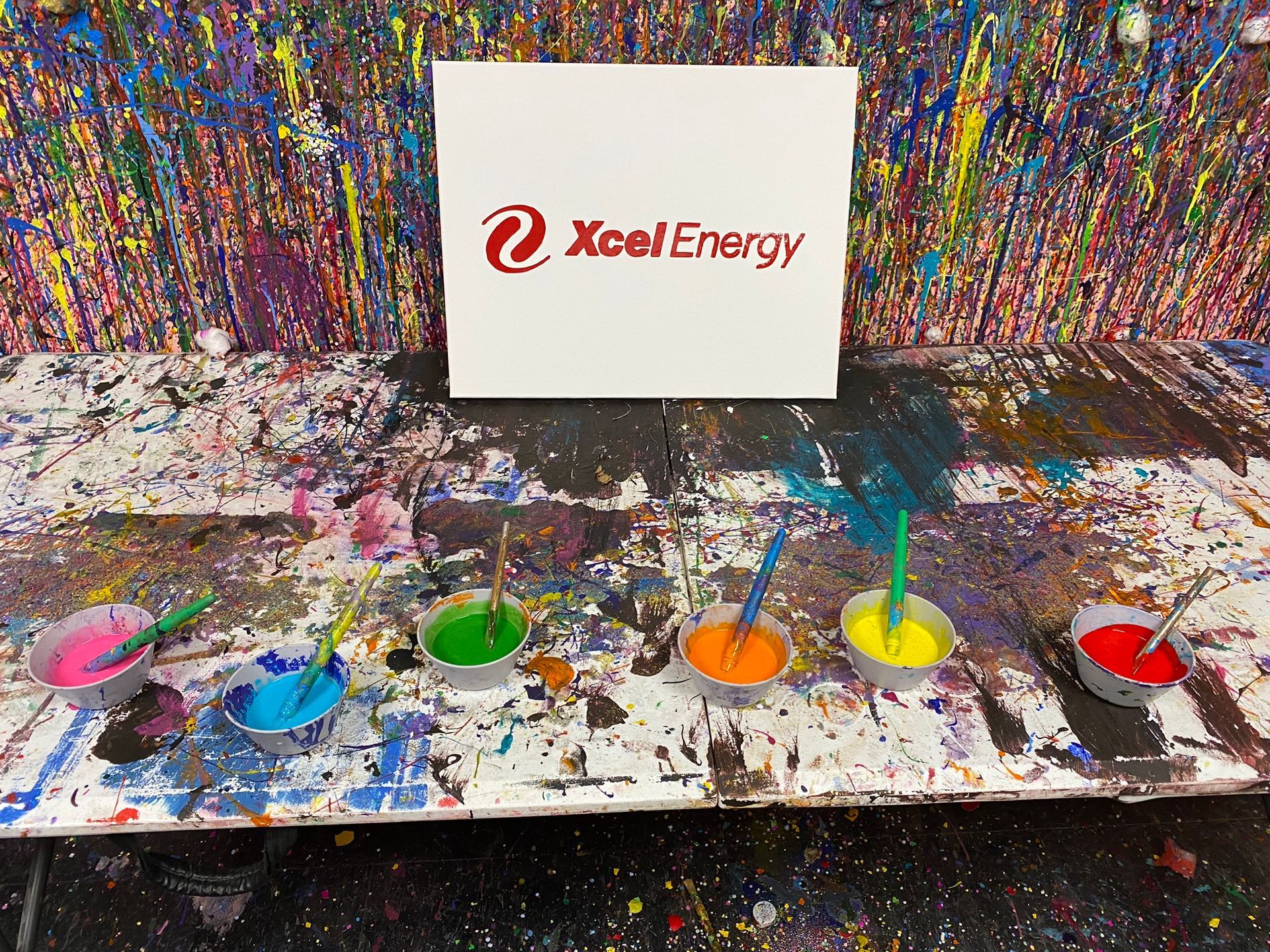 A table with a sign that says xcel energy on it