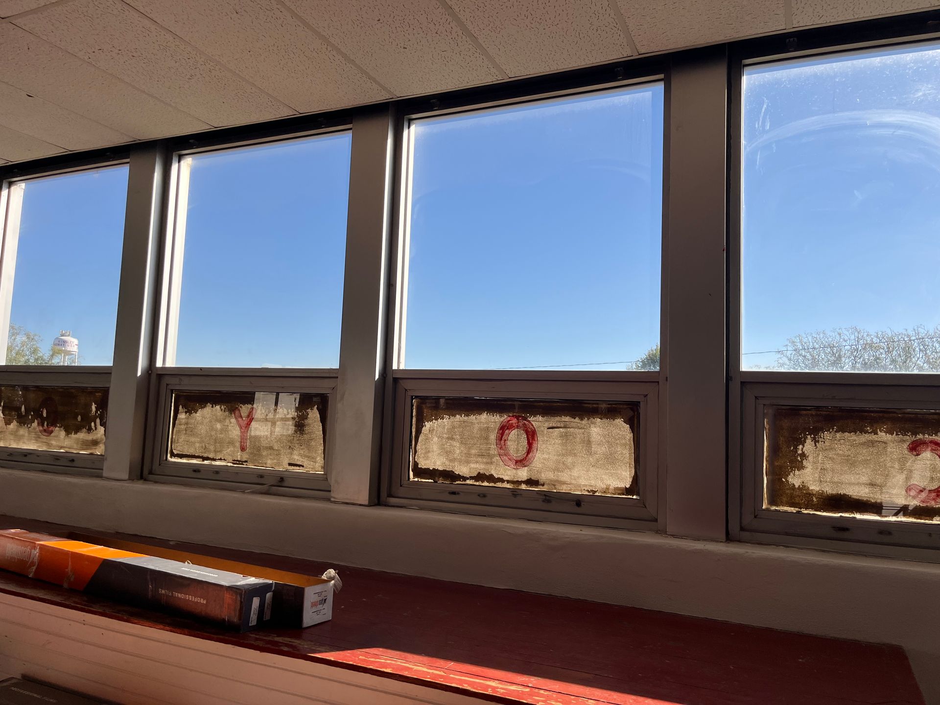 A row of windows with a blue sky in the background