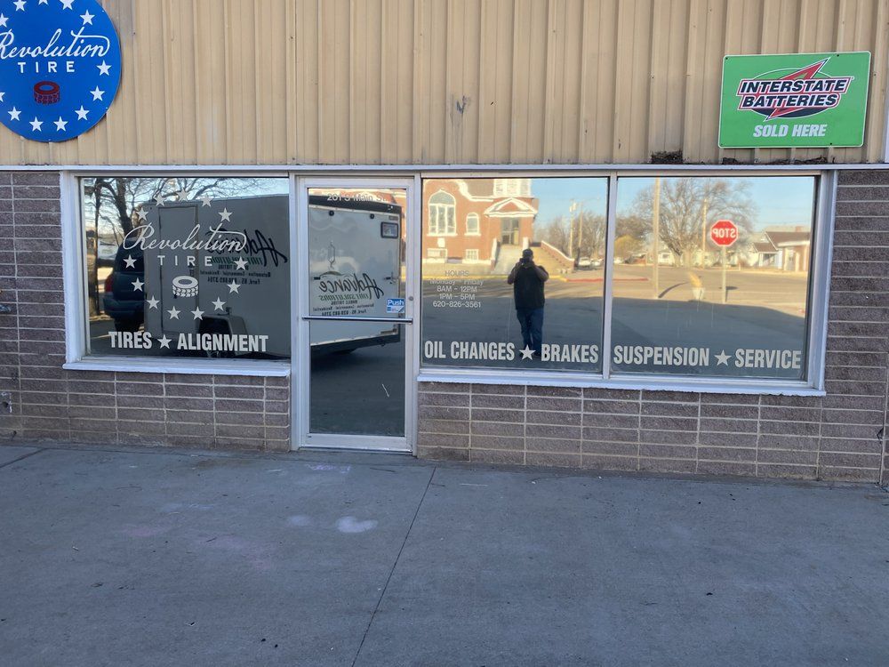 A store front with a sign that says evolution tire