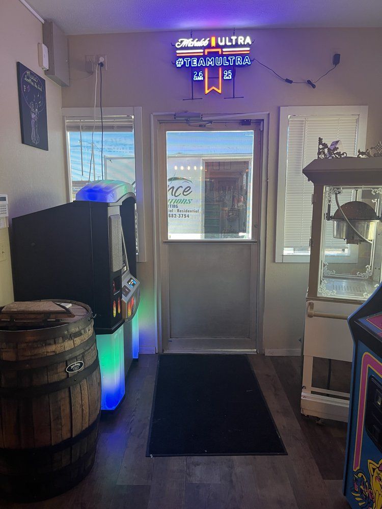 A room with a sign that says miller lite on it