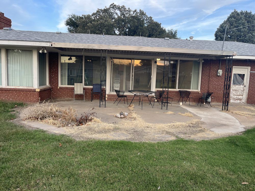 A brick house with a patio in front of it