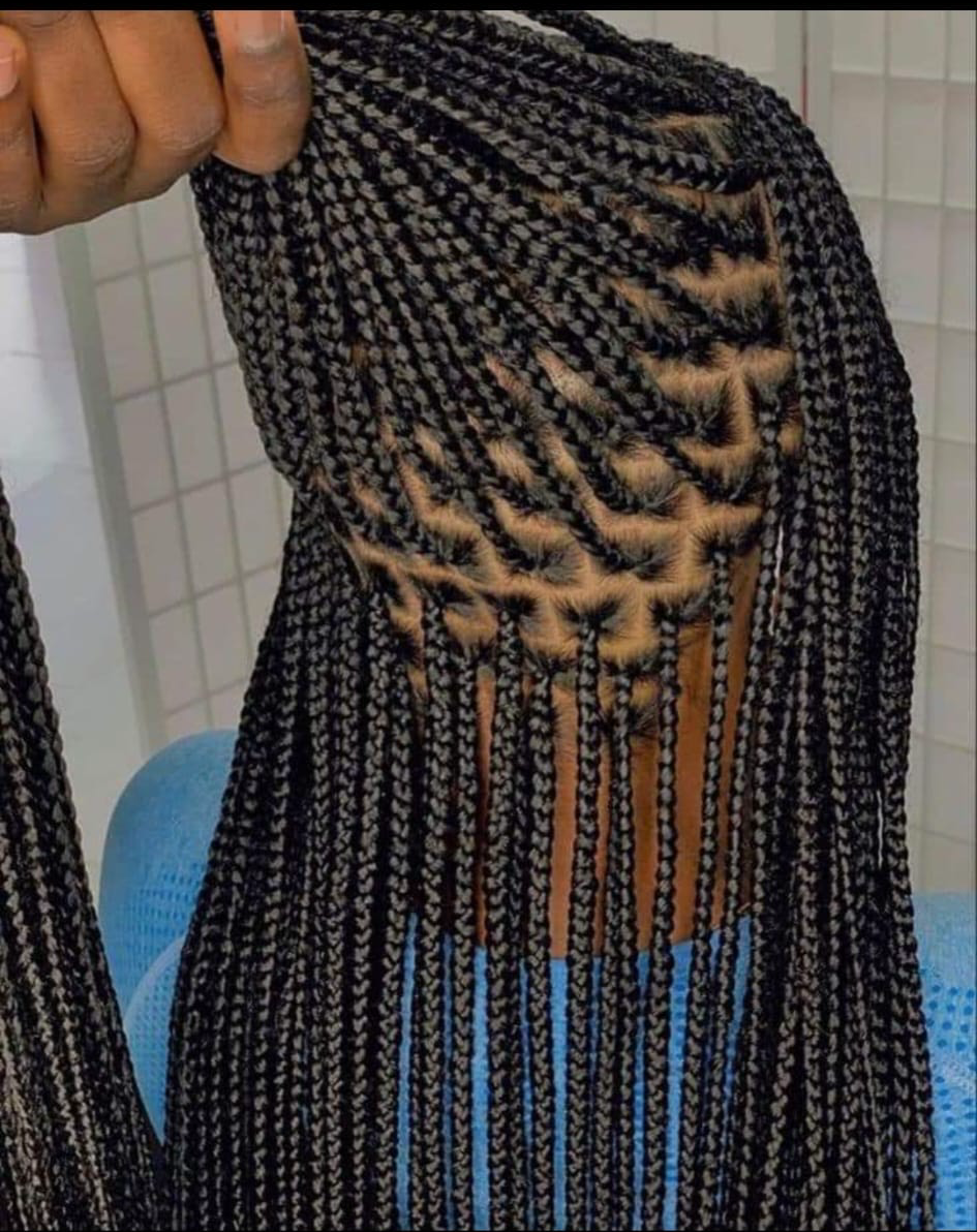 A close up of a person 's hair with braids.