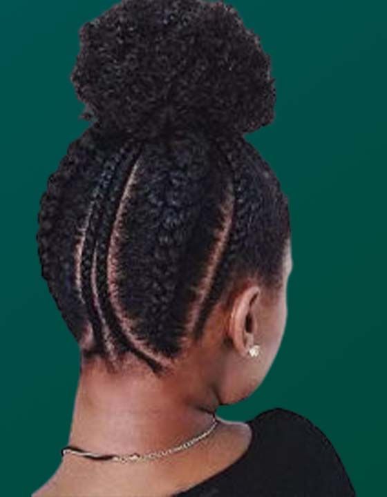 A woman with braids in her hair is wearing a black shirt and a necklace.