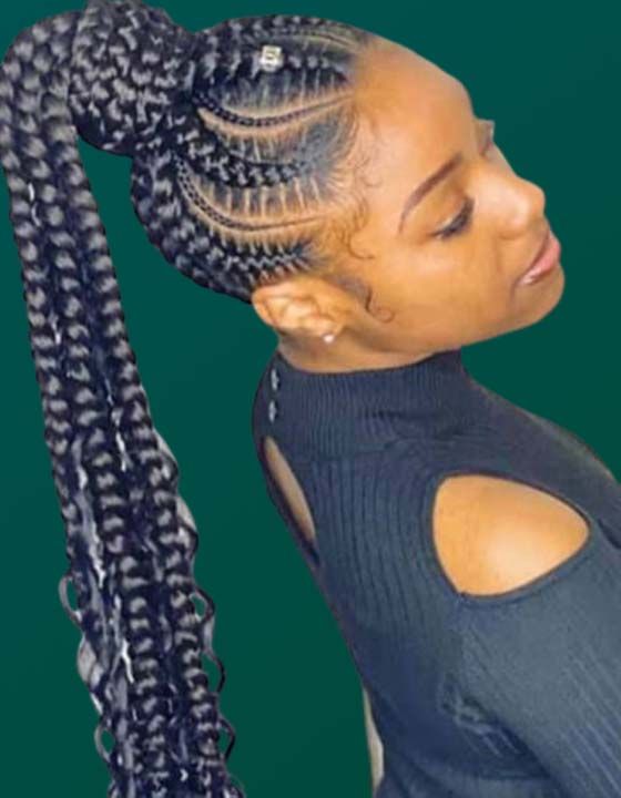 A woman with braids in a ponytail is wearing a black shirt.