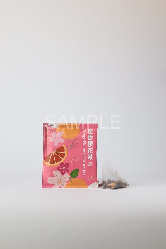 A rectangular box with a fruit-themed illustration featuring a large red apple, citrus, and a purple dragon fruit graphic.