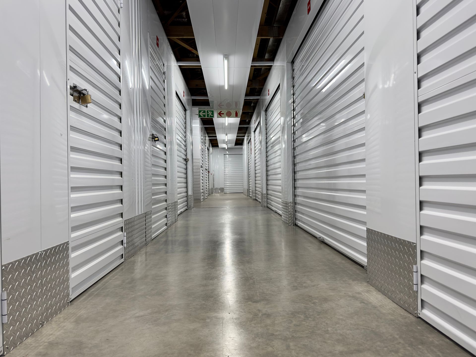 Interior of a modern self-storage facility with metal doors & locks.