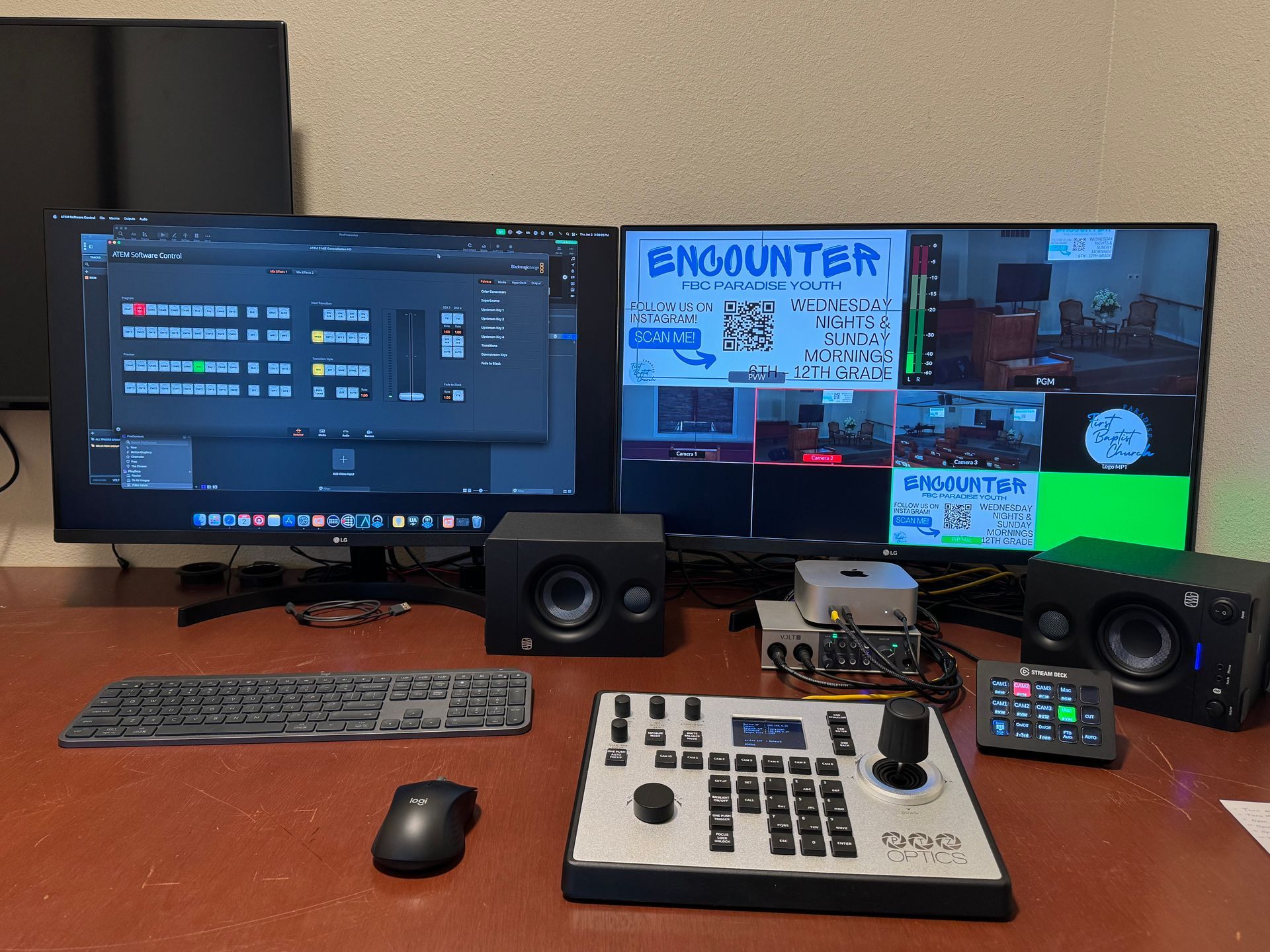 A computer desk with two monitors a keyboard and a mouse