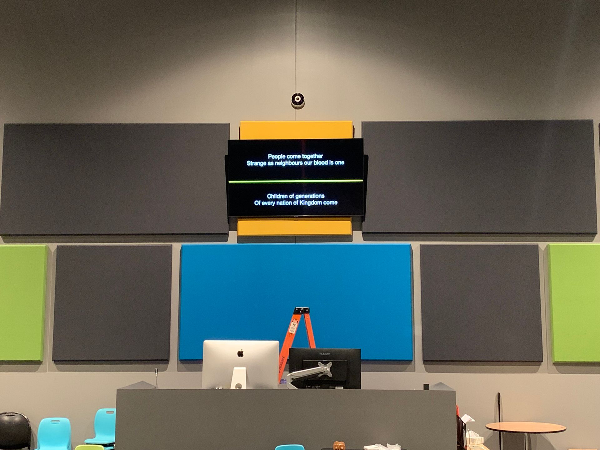 A podium with a computer and a ladder in front of it