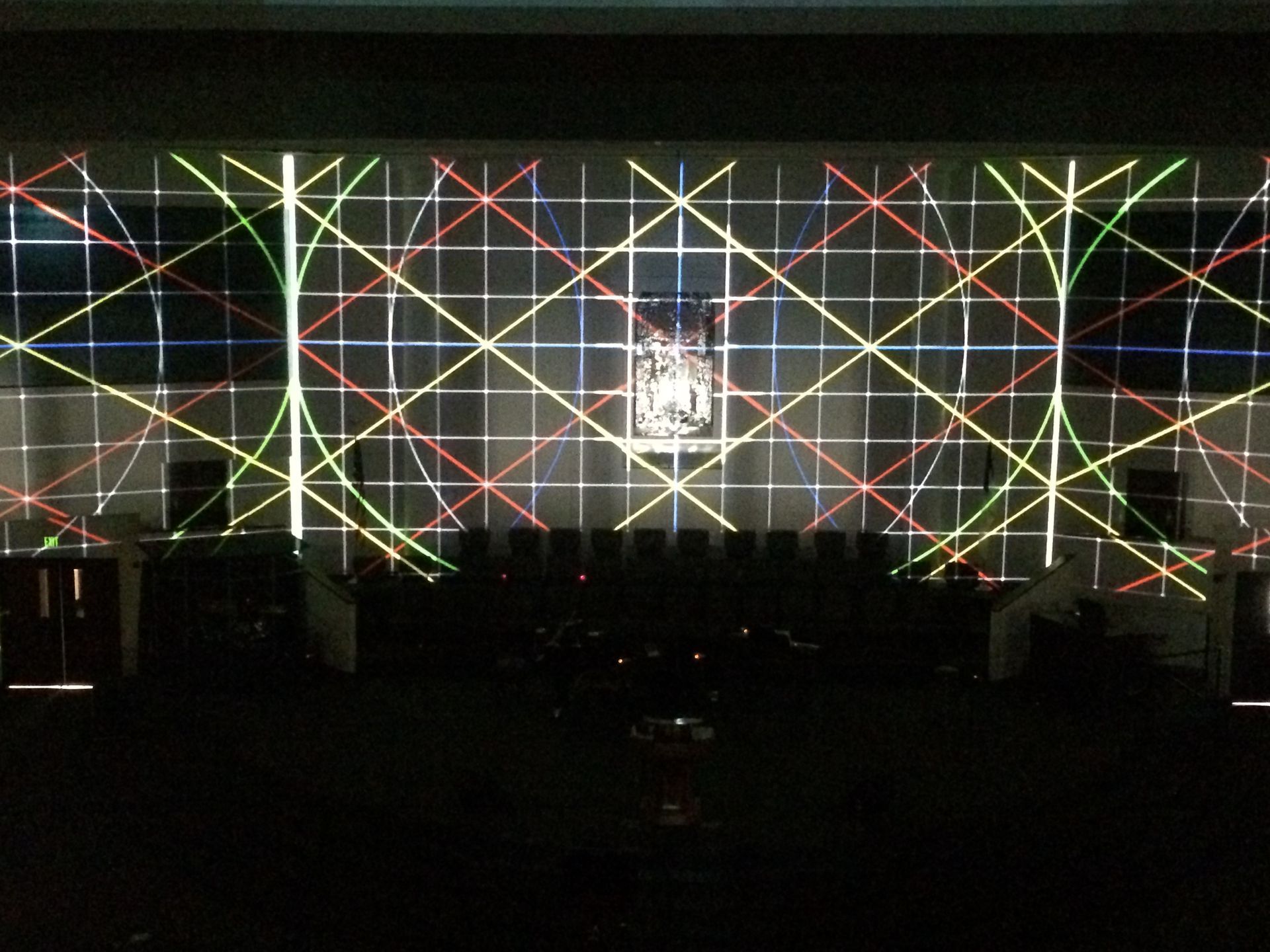 A stage with a grid of lights projected on it