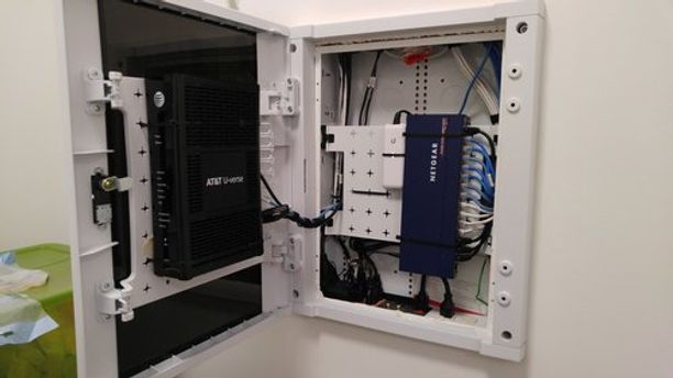 A white box with a computer inside of it.