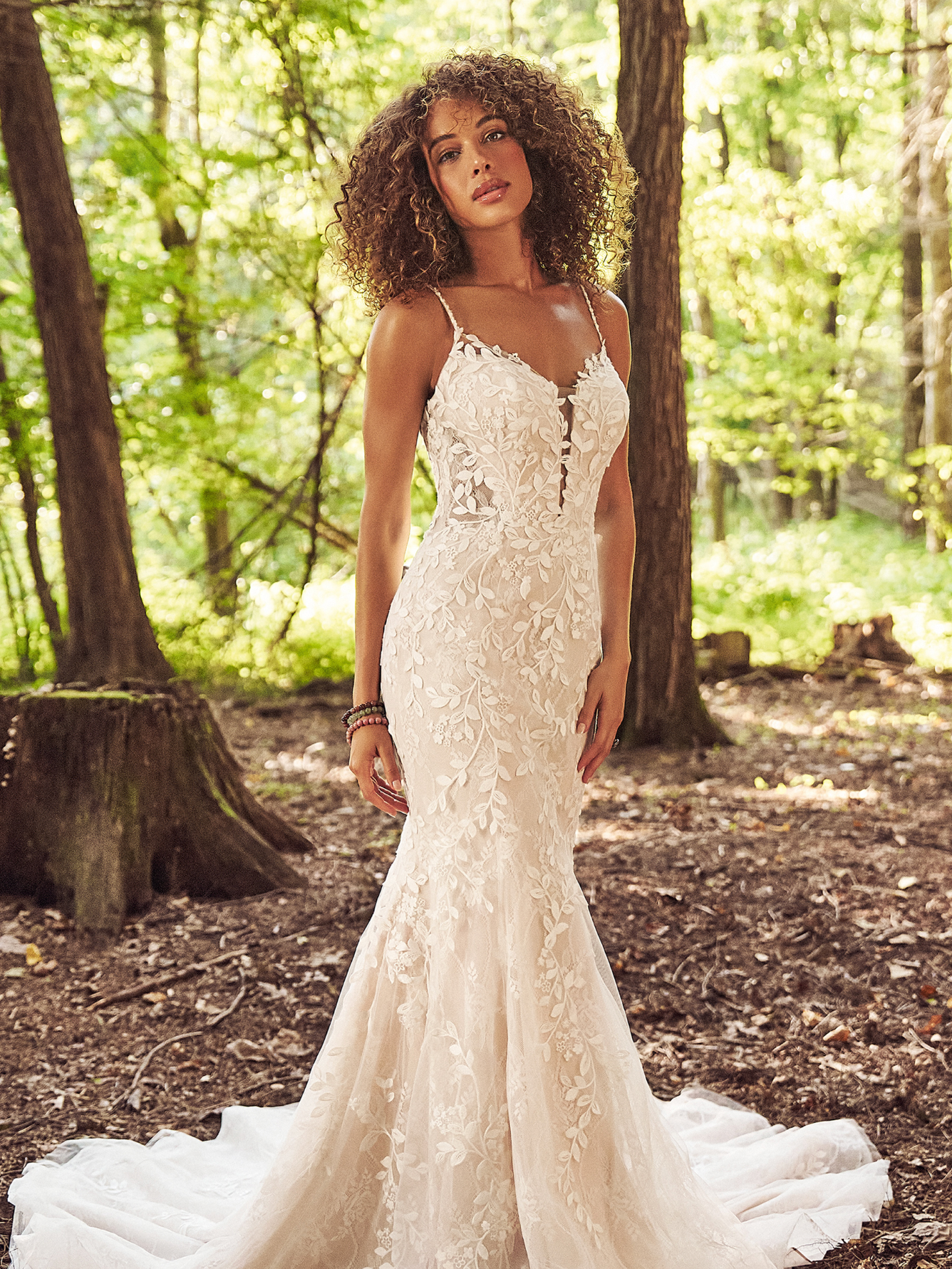 The bride is wearing a black dress and veil and the groom is wearing a black suit.