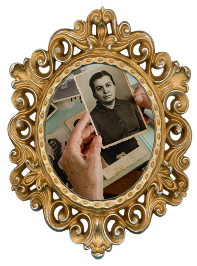 Hand holding a vintage portrait photo inside an ornate gold oval frame