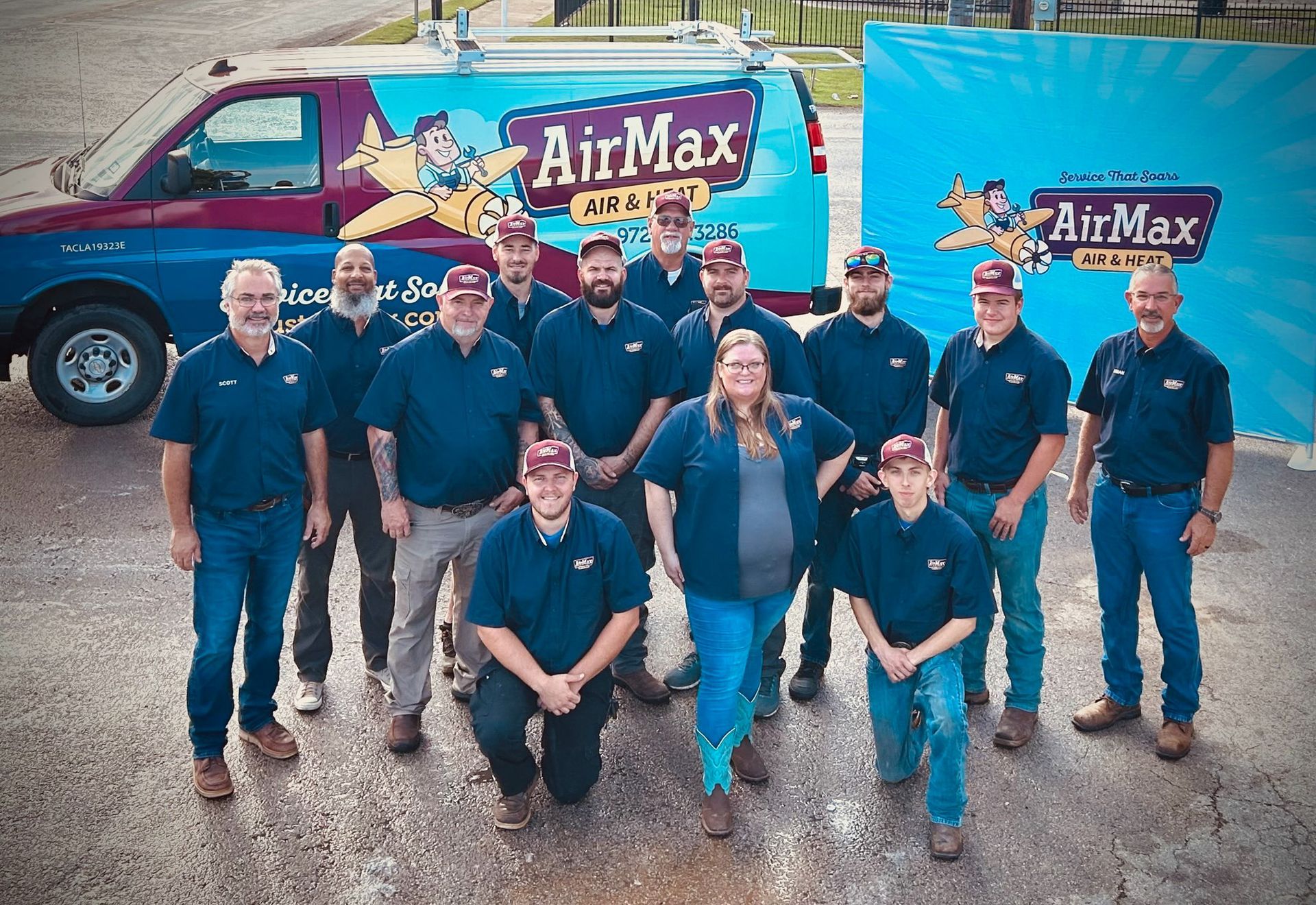 AirMax crew, standing in front of van, poses outside. Air conditioning repairmen.