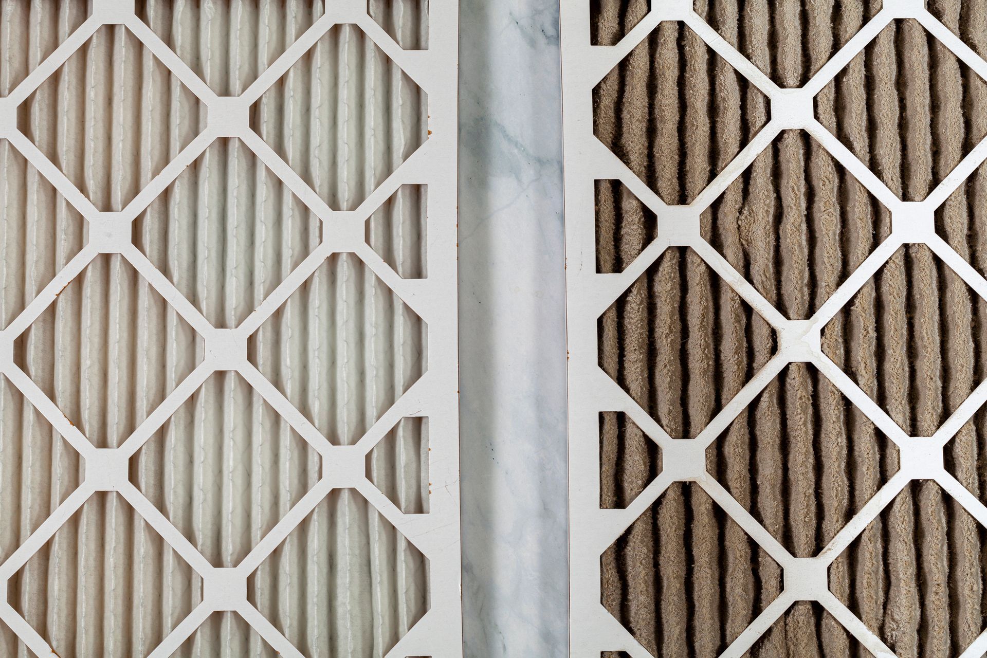 Close-up of white and brown geometric metal lattice panels side by side.