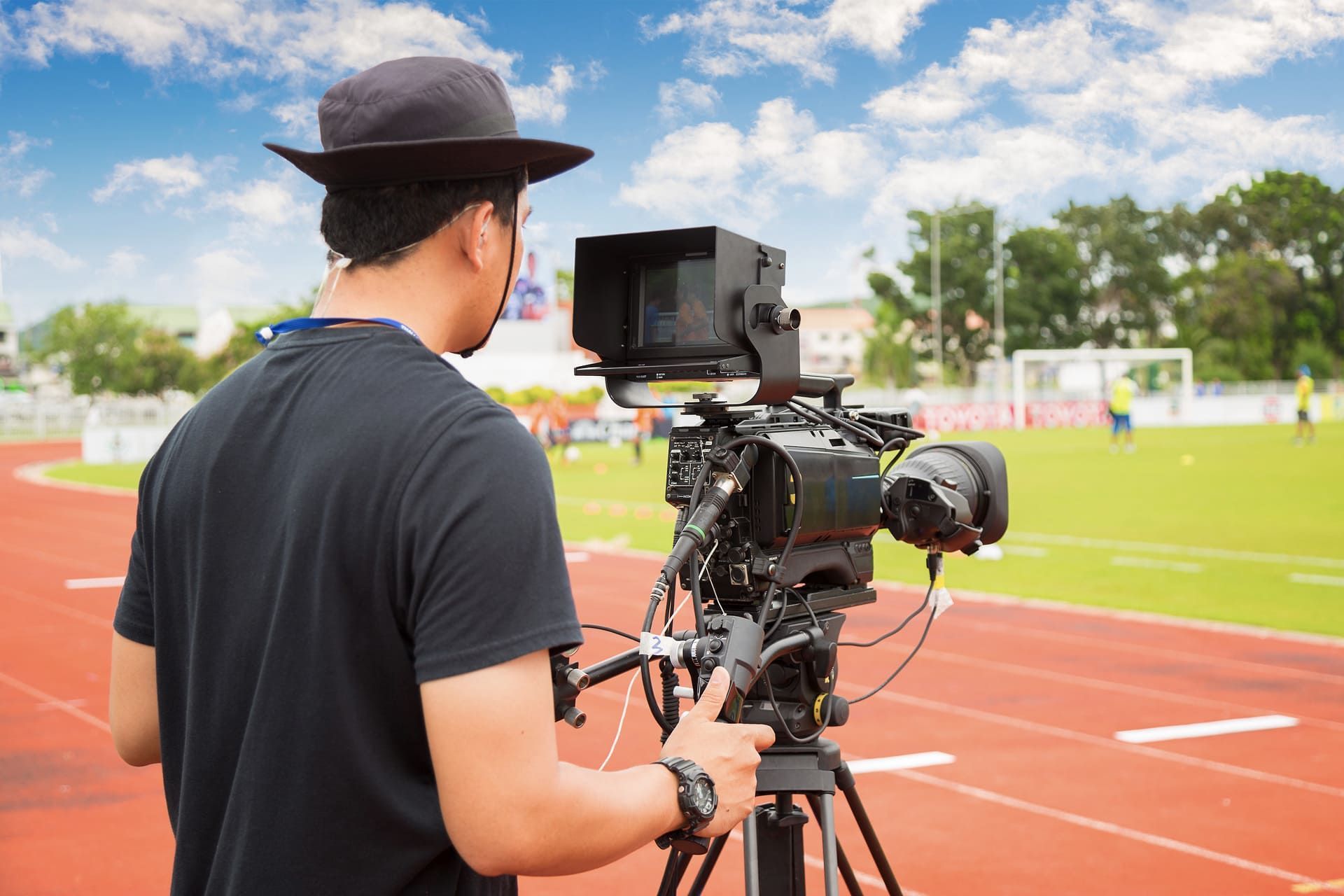 Man with high definition cinema camera on a movie set.