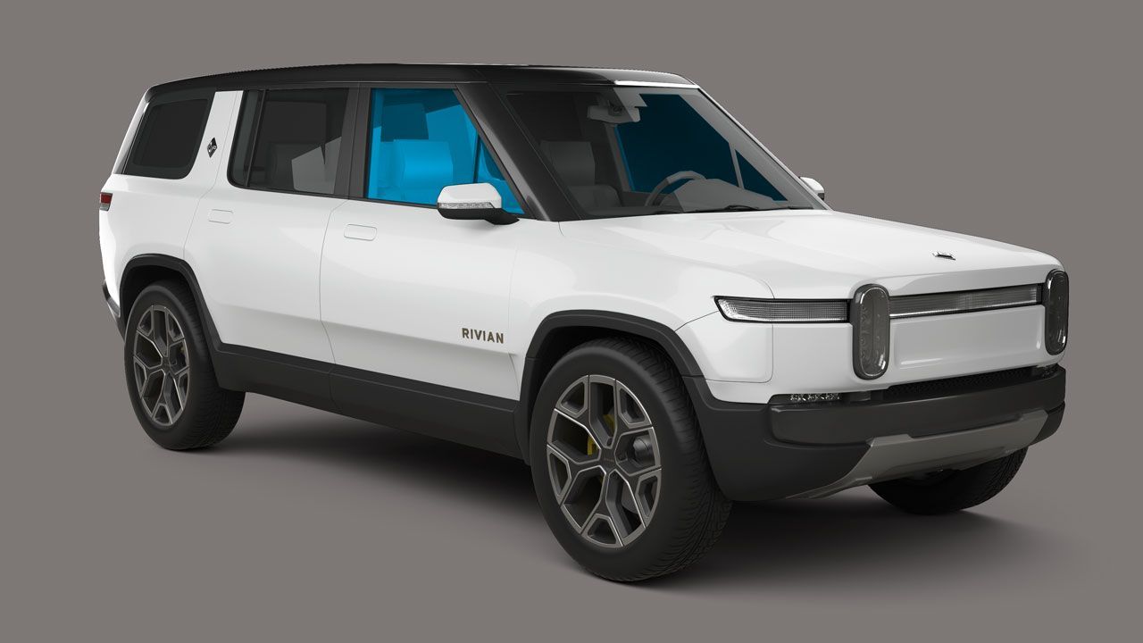 A white suv is sitting on a gray surface.