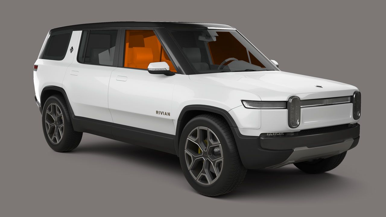 A white suv with orange seats is on a gray background.