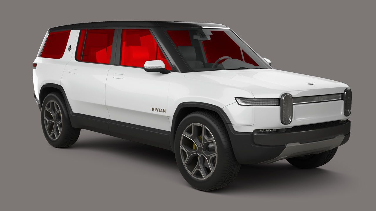 A white suv with red seats is on a gray background.