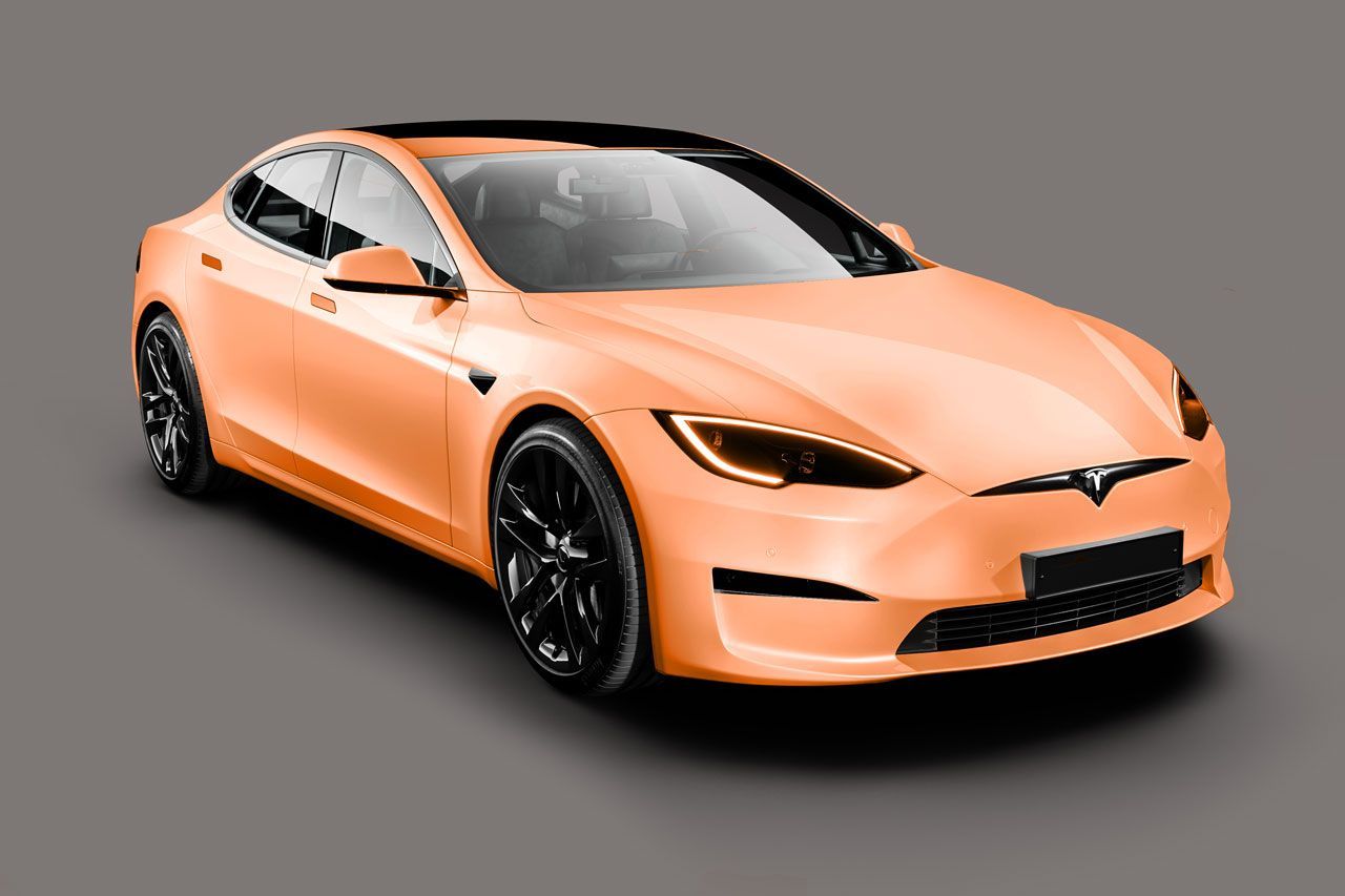 A light orange Tesla Model S with black wheels and a black roof against a grey background.