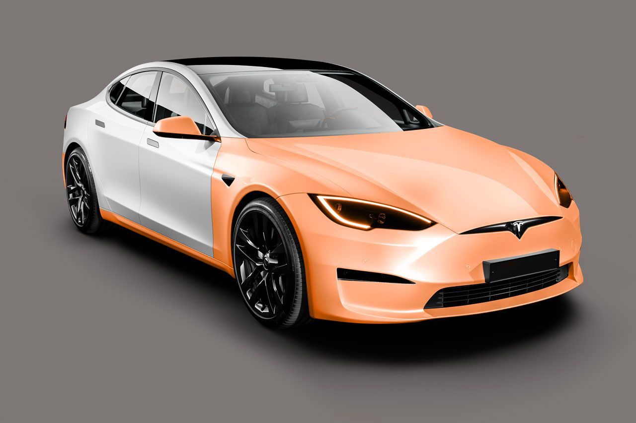 A Tesla Model S shown from a front-quarter angle, with the front half painted peach and the back half painted white.