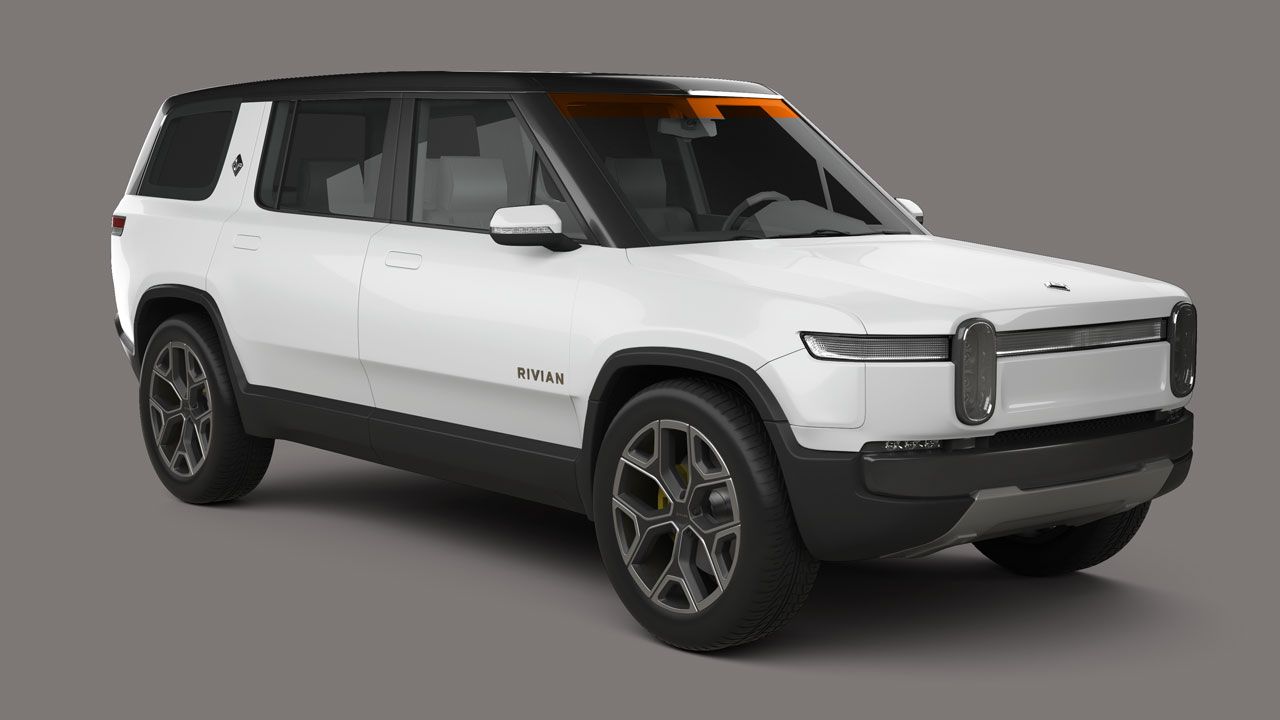 A white suv is sitting on a gray surface.