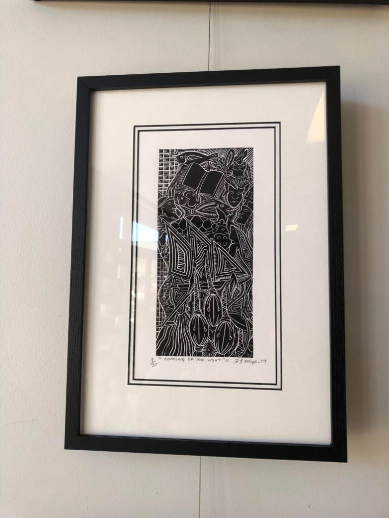 A Black And White Painting In A Black Frame Is Hanging On A Wall — The Picture Framer In Parramatta Park, QLD