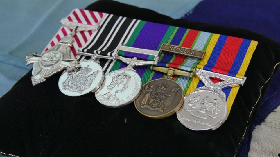 A Bunch Of Medals And Ribbons On A Black Pillow — The Picture Framer In Parramatta Park, QLD