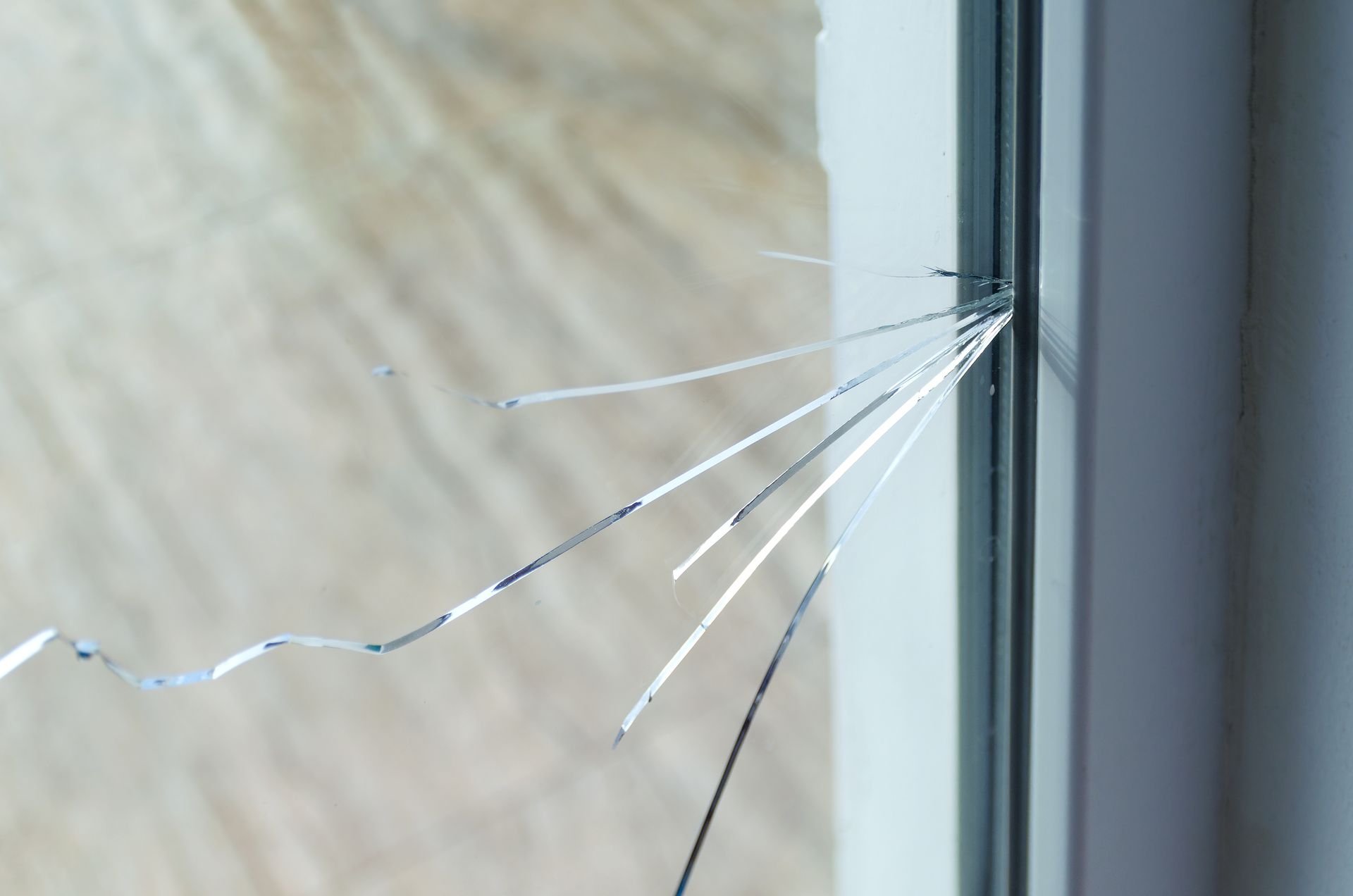 Cracked window glass requiring window repair in a residential home