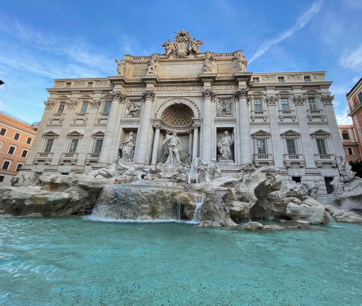 A view of the Trevi Fountain in Rome, Italy on a sunny clear day in September.